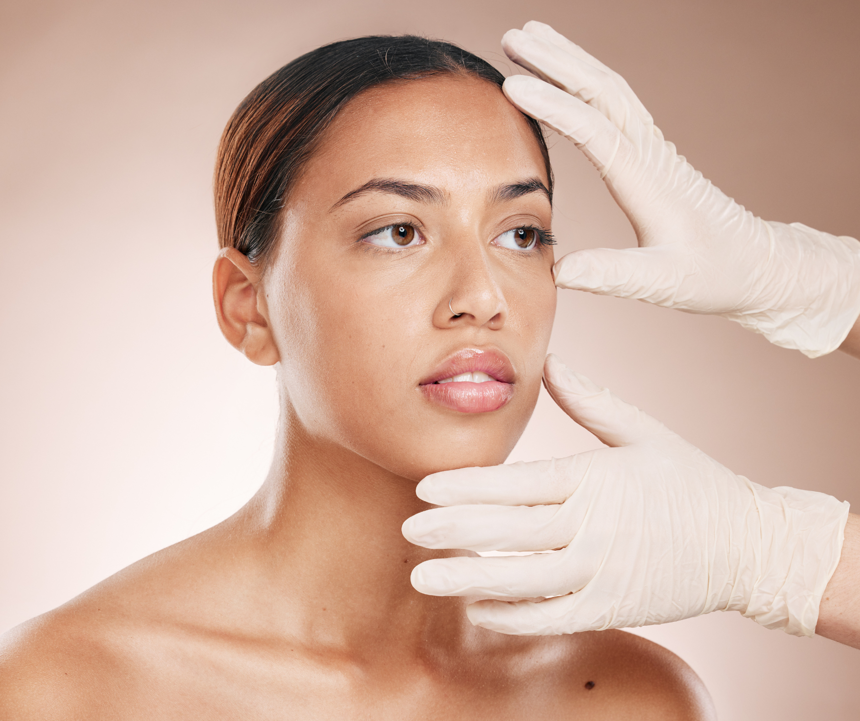 Practitioner examining patient's skin